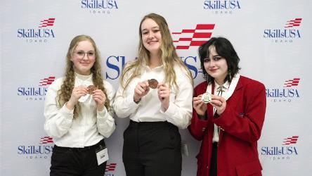 From left, NIC students Kamryn Wixom, Taryn Costa and Ash LaFluer pose for a photo with their SkillsUSA medals on Wednesday, April 9.