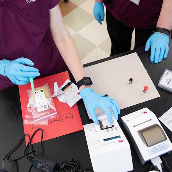 Student looking through a microscope